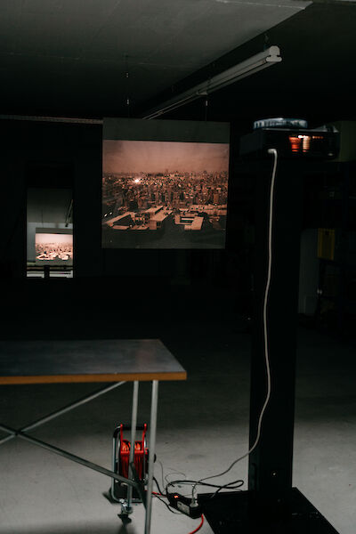Slide projector that projects an image of a city onto a screen.