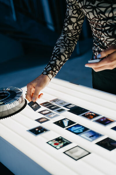 Nathan Ishar sorts slides on a light table.